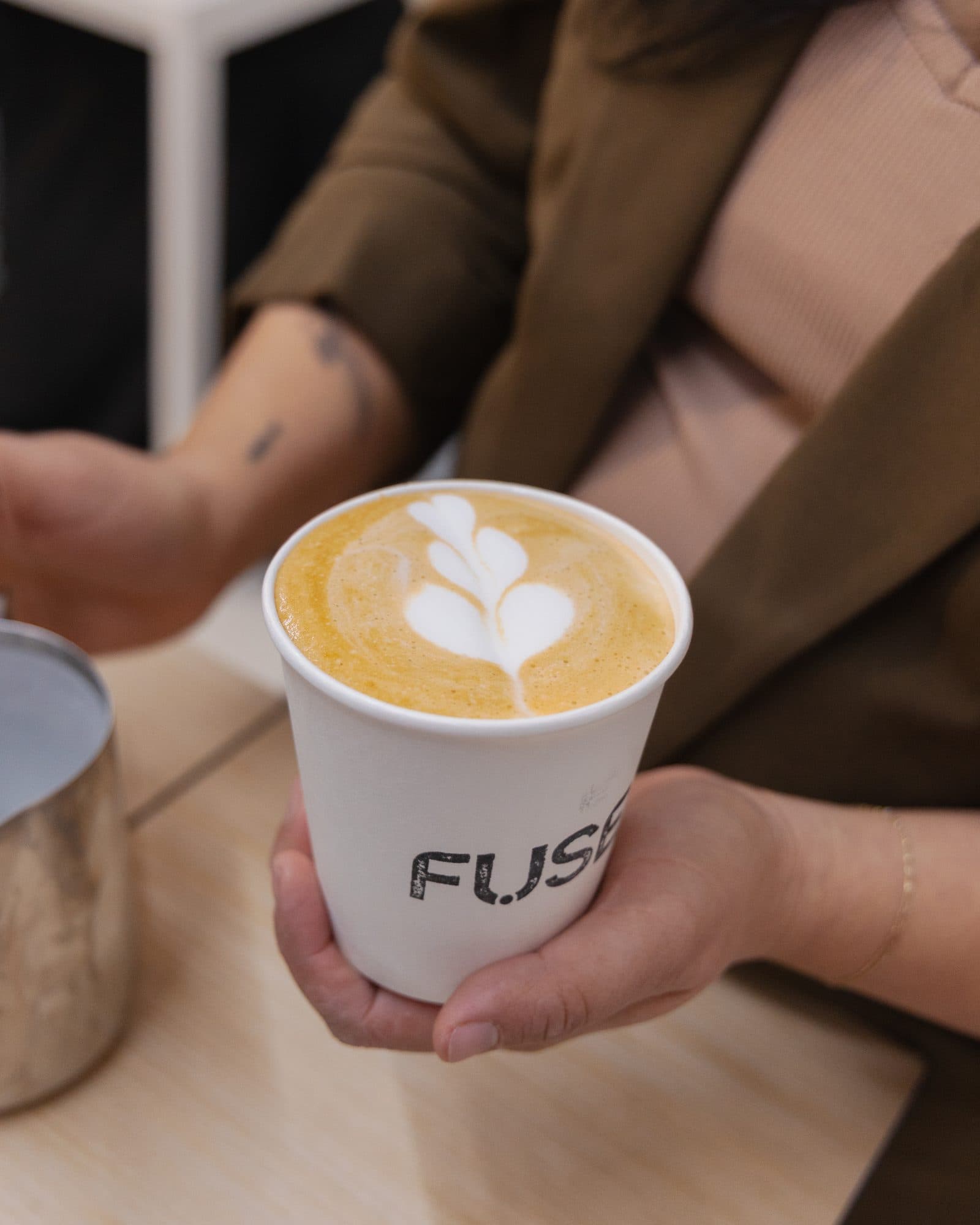 A made-to-order drink handed to a guest at the Motivāt cart