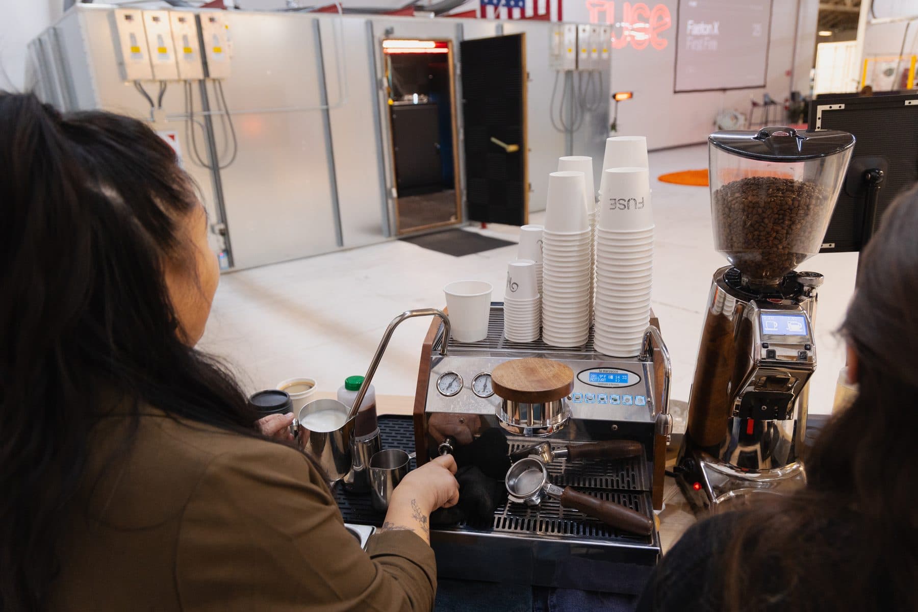 Cups stacked and grinder ready on the Motivāt espresso bar